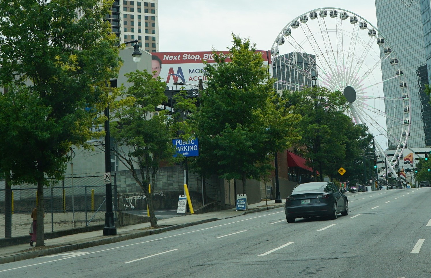 Billboard blocked by trees