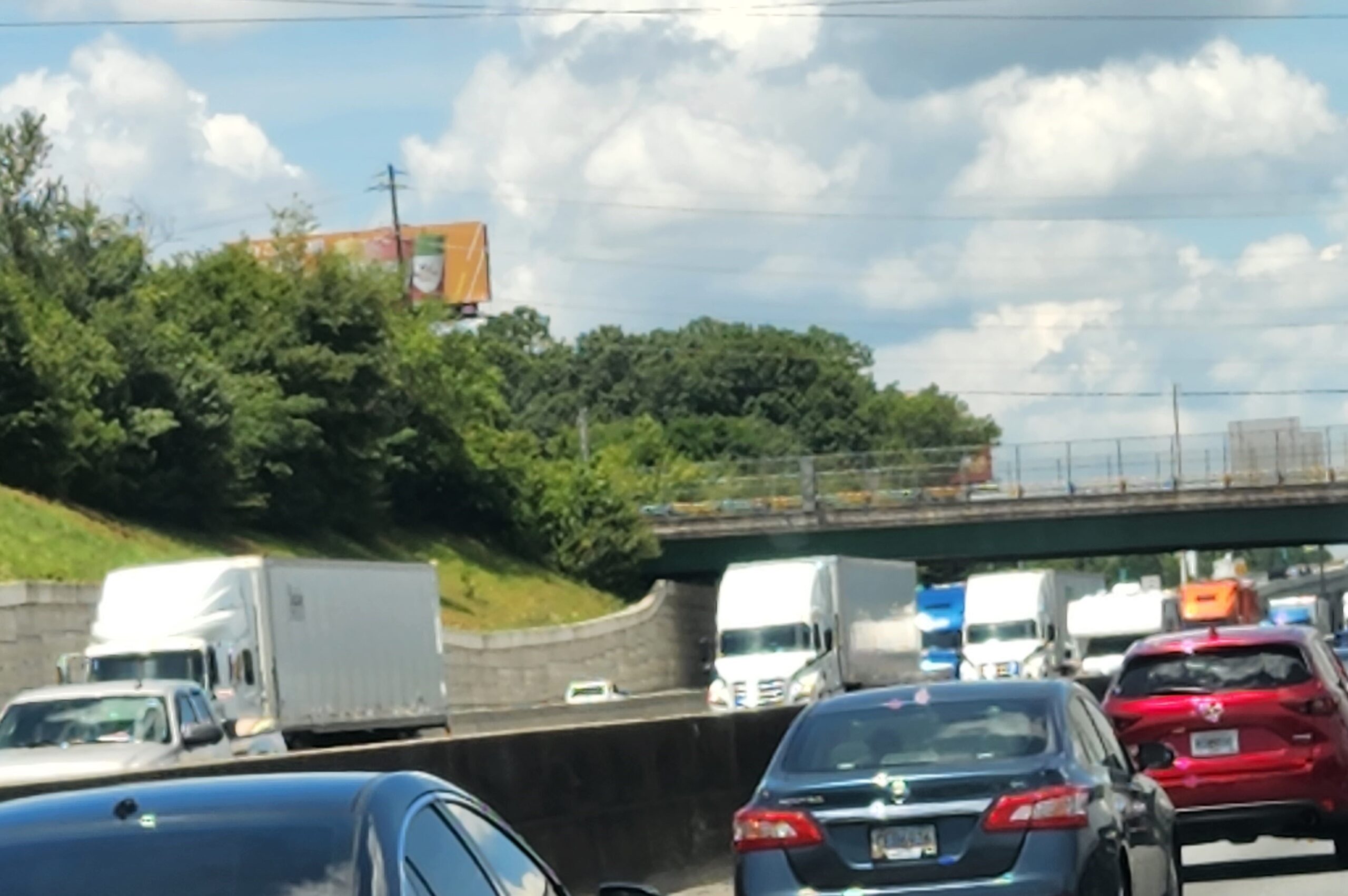 Billboard blocked by trees