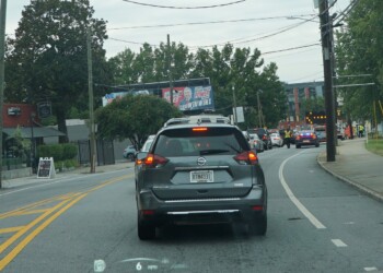 Billboard blocked by trees