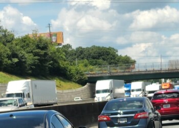Billboard blocked by trees